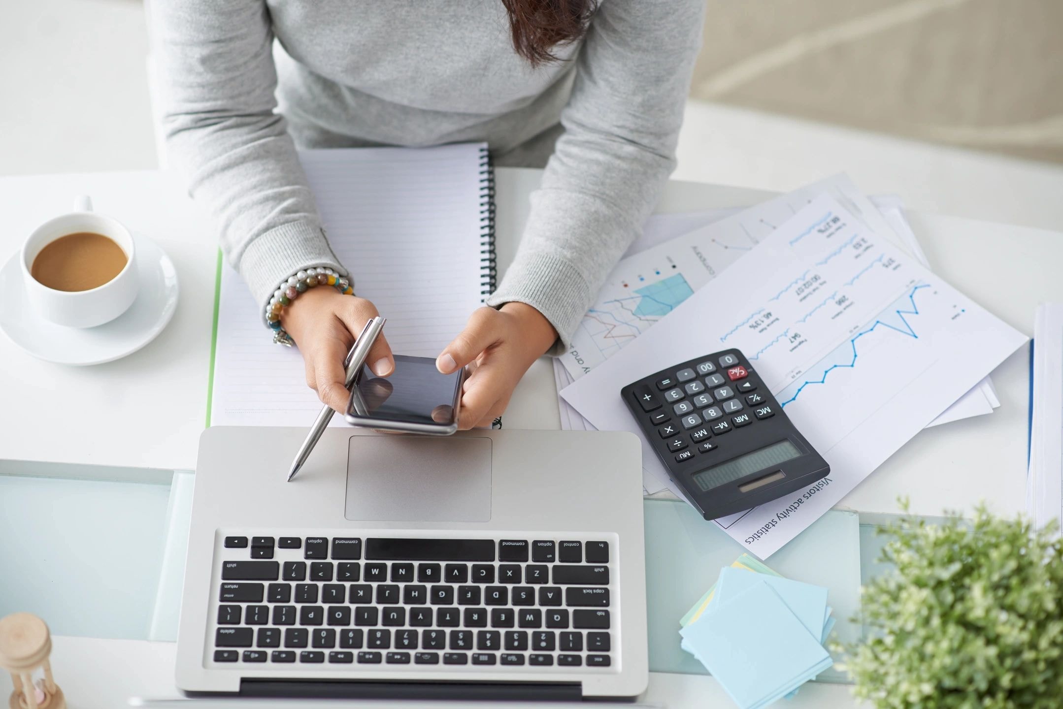 Financial documents and calculator on a desk